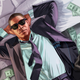 A man lies in a bed full of cash next to a clown mask and a bottle of champagne.